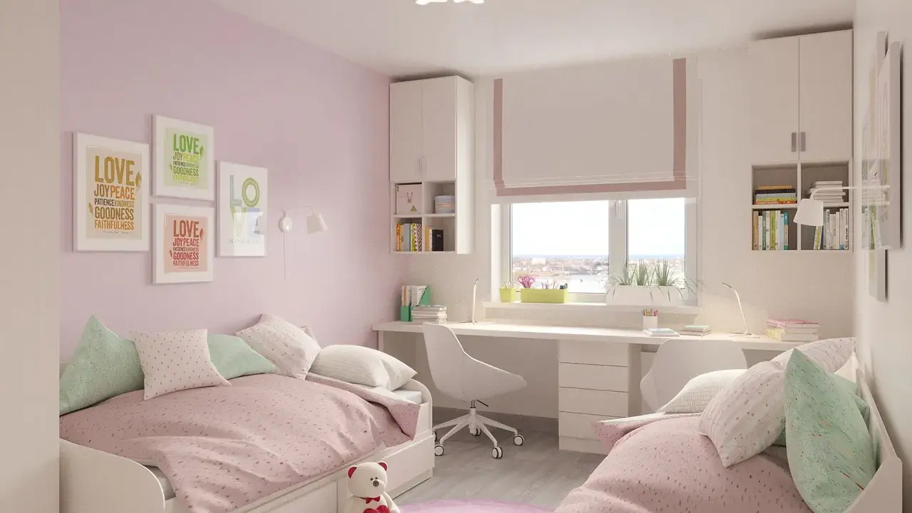 Chambre rose et blanche avec deux lits jumeaux, un bureau et des étagères, idéale pour séparer une chambre en deux.