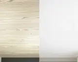 Le lambris en bois clair est recouvert d'enduit blanc, transformant l'espace.