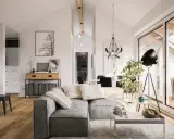 Un salon lumineux et spacieux, parfait pour **rénover mon appartement**. Canapé gris, parquet, et une grande baie vitrée donnant sur une terrasse.