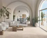 Un salon lumineux avec des arches, des plantes et un canapé confortable. Le sol en carrelage clair est idéal pour ce style méditerranéen. Quel revêtement de sol choisir ?