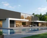 Une **maison cube moderne plain-pied** avec piscine, entourée d'arbres. Lignes épurées, grandes baies vitrées, terrasse en bois.
