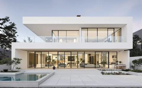 Une maison design moderne avec piscine, de grandes baies vitrées révélant un intérieur lumineux et épuré.