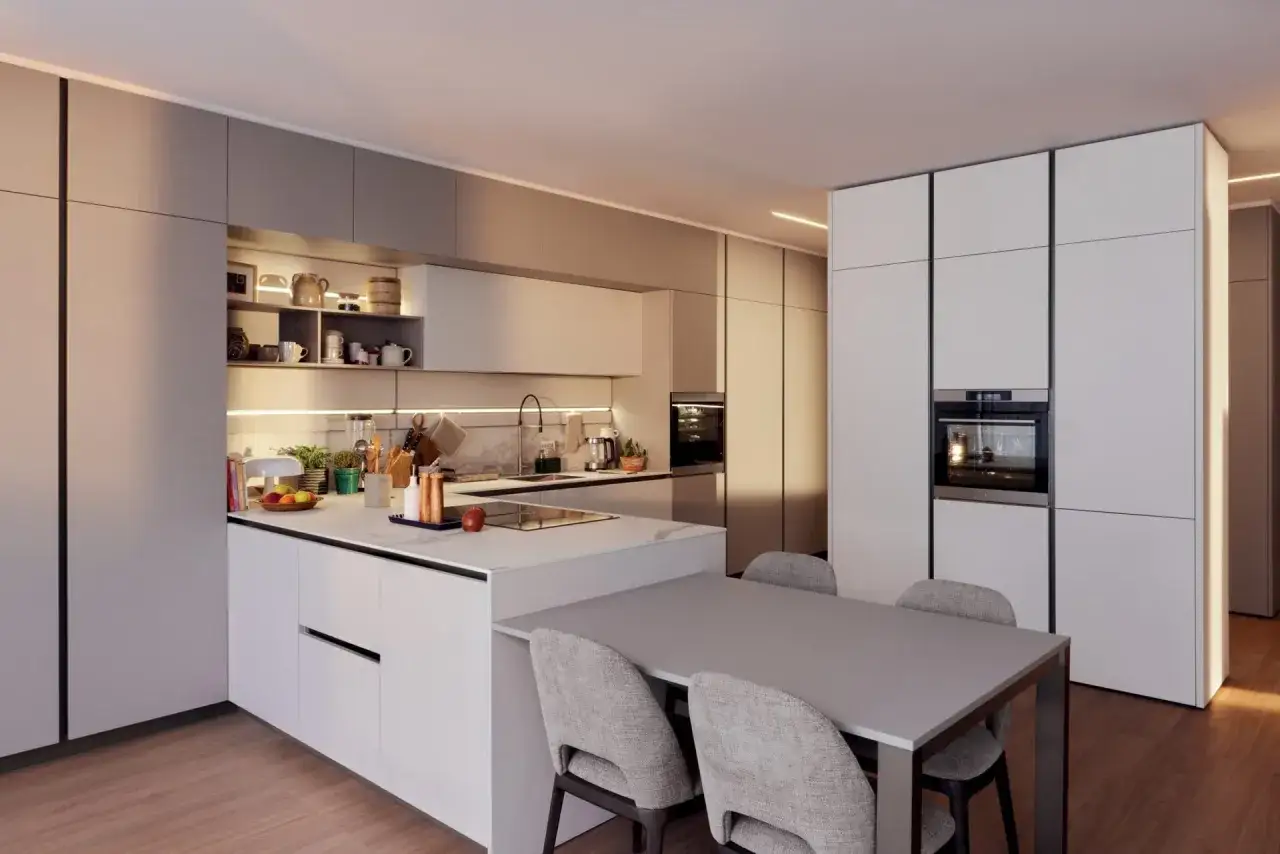 Aménager une cuisine ouverte moderne avec îlot central, table et chaises. L'espace est lumineux et épuré, parfait pour recevoir.